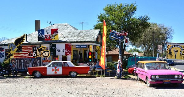 A storefront building with murals and Route 66 signage in the Seligman Commercial Historic District